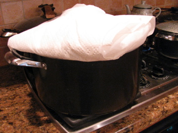 Cover the lid with a towel to steam